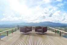 3D Rendering : Illustration Of Resting Area Of Balcony With Two Couch Armchair Sofa Outdoor. High View. Sun Deck Of Resort. Mountain View And Blue Sky With Cloud. Take A Rest Time Concept.