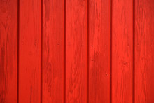 Old Wooden Background Painted With Red Paint With A Texture Of Cracks And Scratches. Red Background