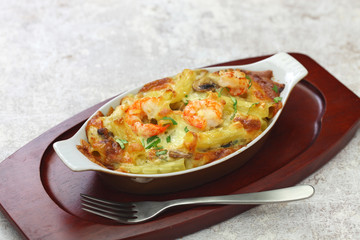 Wall Mural - homemade baked shrimp macaroni cheese gratin, casserole dish