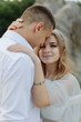 © wolfhound911 - Photoshoot of a couple in love in the mountains. The girl is dressed like a bride in a wedding dress.