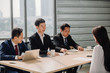 © nikomsolftwaer - Woman during job interview and four elegant members of management