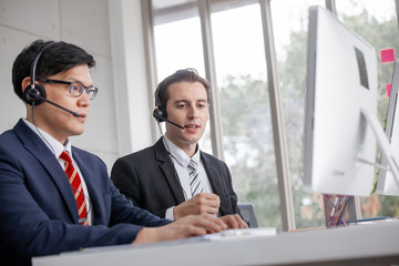 operator with hands-free headset working in the office