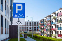 Disability Reserverd Parking Zone. Sign Of Wheelchair. Sunny Day, Residential Area