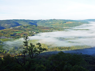 View of the Mirna River valley and autumn morning fog from the old town of Motovun - Istra, Croatia (Pogled na dolinu rijeke Mirne i jesenju jutarnju maglu sa starog grada Motovuna - Istra, Hrvatska)