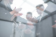 © ASDF - business people shaking hands at an office meeting.