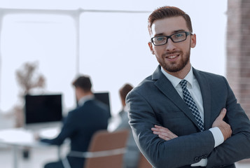 successful businessman on background of office