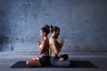 Latin couple practice meditation together. Concept of mindfulness and trust. 