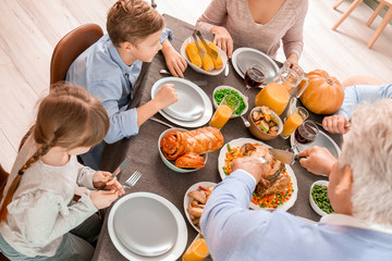 Wall Mural - Family celebrating Thanksgiving Day at home