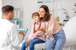 © Pixel-Shot - Woman with little daughter visiting pediatrician in clinic