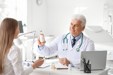 Sticker - Doctor giving pills to patient in clinic