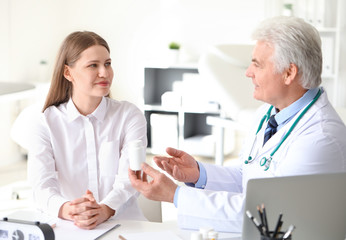 Sticker - Doctor giving pills to patient in clinic