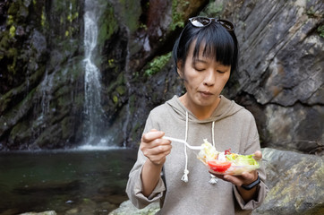 Wall Mural - Asian woman eat salad