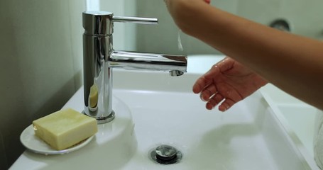 Wall Mural - Washing hands. Coronavirus pandemic prevention washing hands with soap bar. Woman using correct handwashing technique using personal soap bar.