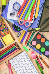 Wall Mural - School supplies on wooden desk. Children creativity flat lay