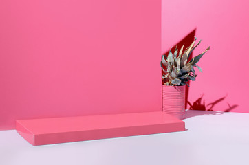 Wall Mural - A bright, surreal pineapple stands on a table against a pastel pink wall. The concept of decor, new fashion, fresh ideas.