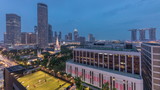 Fototapeta Nowy Jork - Singapore skyline with St. Andrew's Cathedral aerial day to night timelapse.