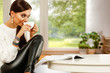 © magdal3na - White table background of free space and slim young woman with spring window