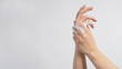 © nisara - Hands washing gesture with foaming hand soap on white background.