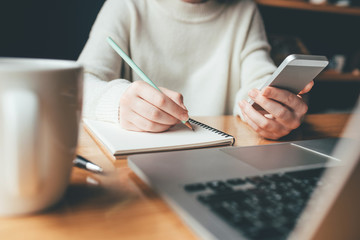 Young woman working in a home office. Remote work concept.