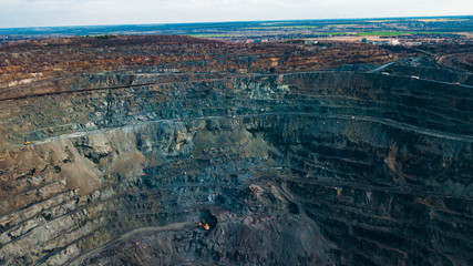 Aerial view of the Iron ore mining, Panorama of an open-cast mine extracting iron ore, preparing for blasting in a quarry mining iron ore, Explosive works on open pit