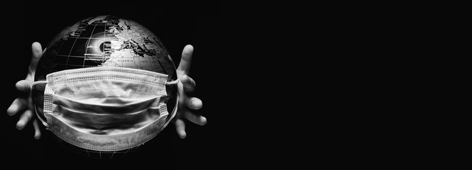 Wall Mural - kid holding globe map sphere isolated on black horizontal background. ecological problems disasters.