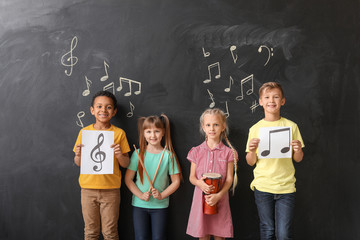 Sticker - Little children near chalkboard at music school