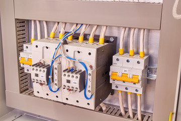 two power contactors with front additional contacts and two circuit breakers in the electrical cabin