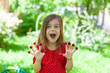 © olsima - Young girl is holding raspberries on her fingers, outdoor shoot