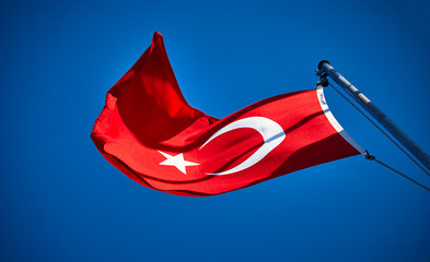 Turkish flag waving in blue sky, Istanbul, TURKEY