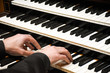 Close-up male musician hands playing the pipe organ