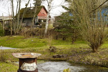  Dilapidated Hut With A Small Pond And Trash