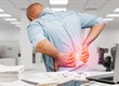 © BillionPhotos.com - Business man with back pain an office . Pain relief concept