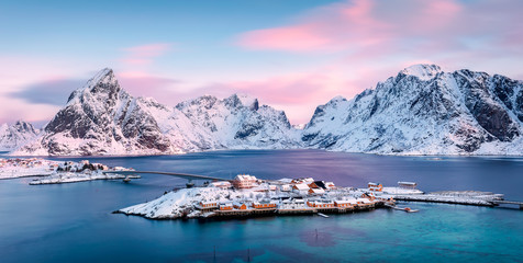 Wall Mural - panoramic view to sakrisøya island with mountains on background at sunrise - lofoten islands, norway