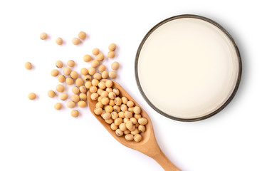 Sticker - Closeup soy beans in wooden bowl and glass of soy milk isolated on white background. Top view. Flat lay.