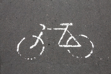 Bicycle pictogram icon drawn on the pavement.