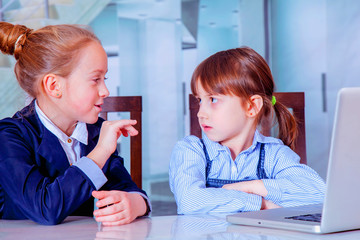 Teamwork concept. Humorous photo of group of two young business child girl working, communicating and having online meetingwhile.