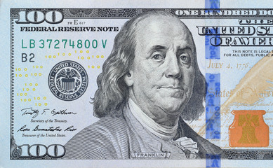 portrait of us president benjamin franklin on 100 dollars banknote closeup macro fragment. united st