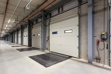 Inside Of A Warehouse With A Row Of Loading Bays