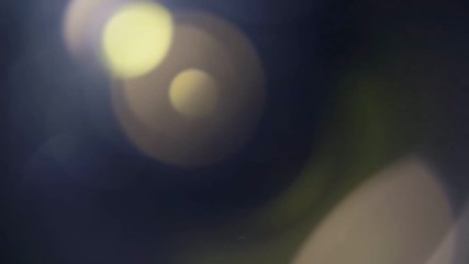 Wall Mural - beautiful abstract defocused lens flare on a dark background. real light leaks and lens flare.