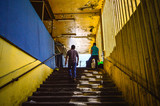 Fototapeta Na drzwi - man walking on stairs