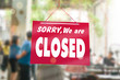 © ant - Sorry we are closed sign hang on door of business shop.