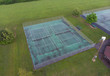 Set of tennis courts aerial view after summer rainfall