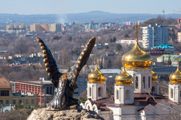 Eagle sculpture and church view