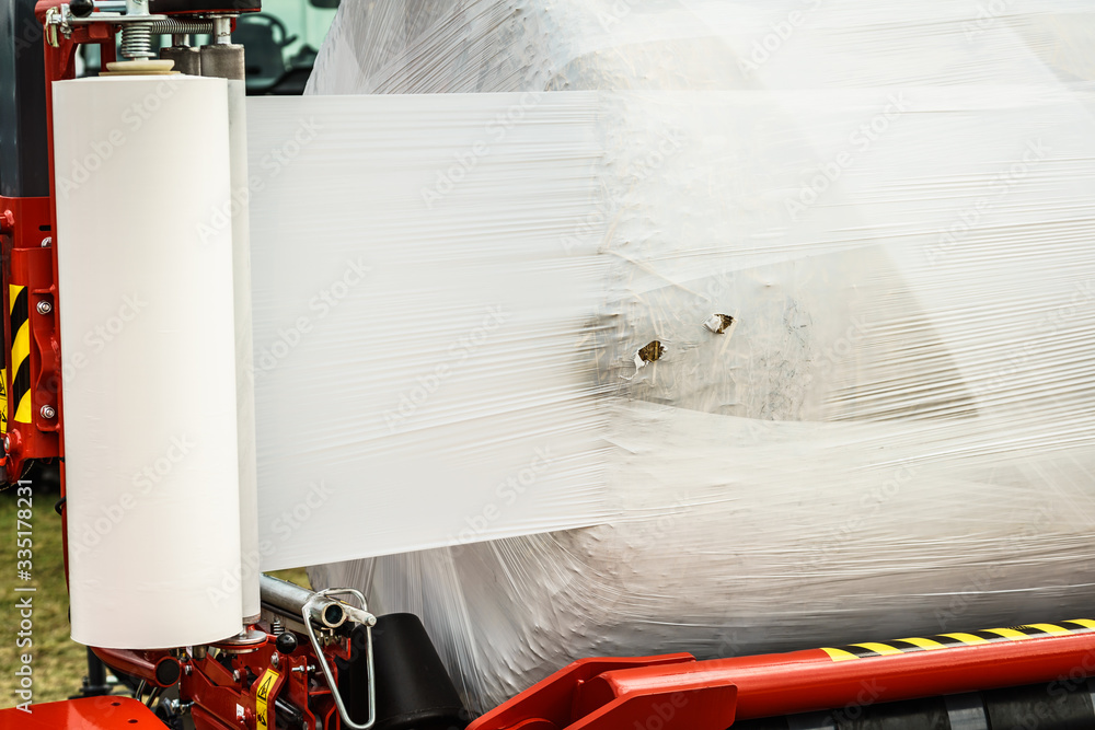 Bale of hay wrapped in plastic foil