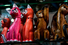 Wooden Figurines Of Different Colors And In Different Poses