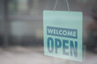© pandaclub23 - Open and welcome sign broad through the glass of window