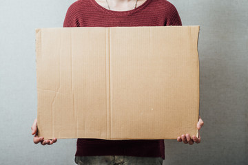 man holding cardboard