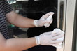 © Chounchom - Cleaning staff cleaned the door knob or door holder with alcohol spray and wipe out with cleaned paper. Protection infected corona virus from touch public object.