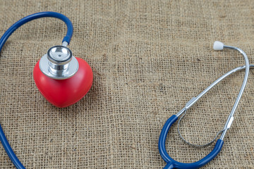 Wall Mural - Stethoscope and red heart for check health isolate on white