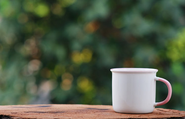 Canvas Print - cup of coffee on wood counter background and space for text